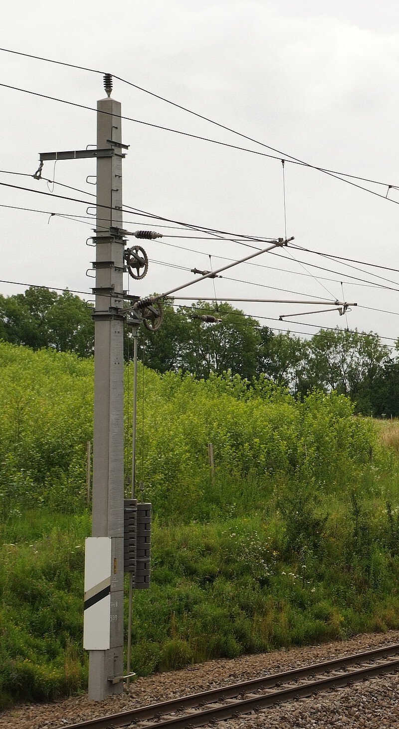 Catenary in Austria with overhead contact wire, carrying cable and insulators