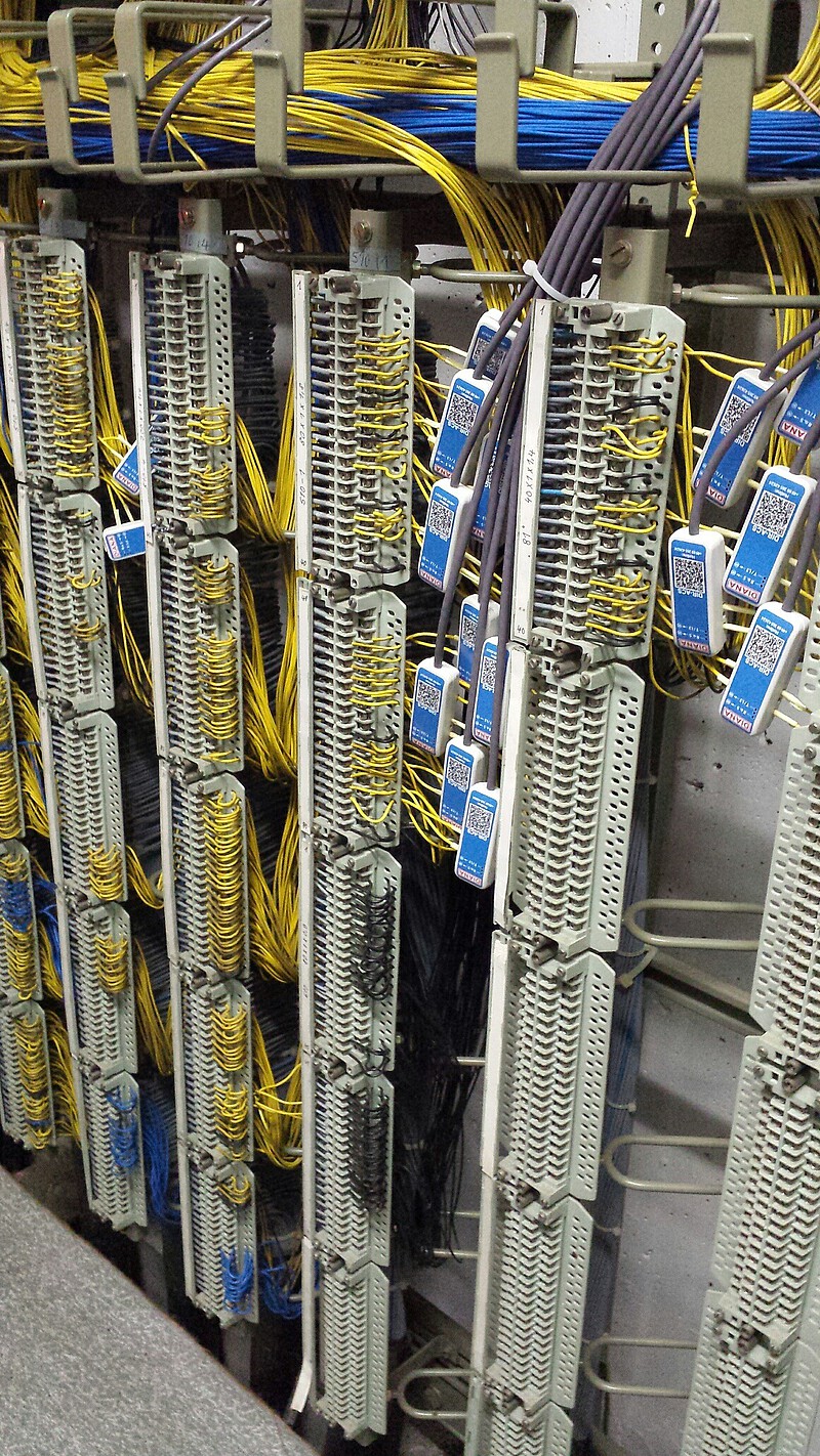 View into the control unit of an interlocking system with cables and sensors installed on the cables.